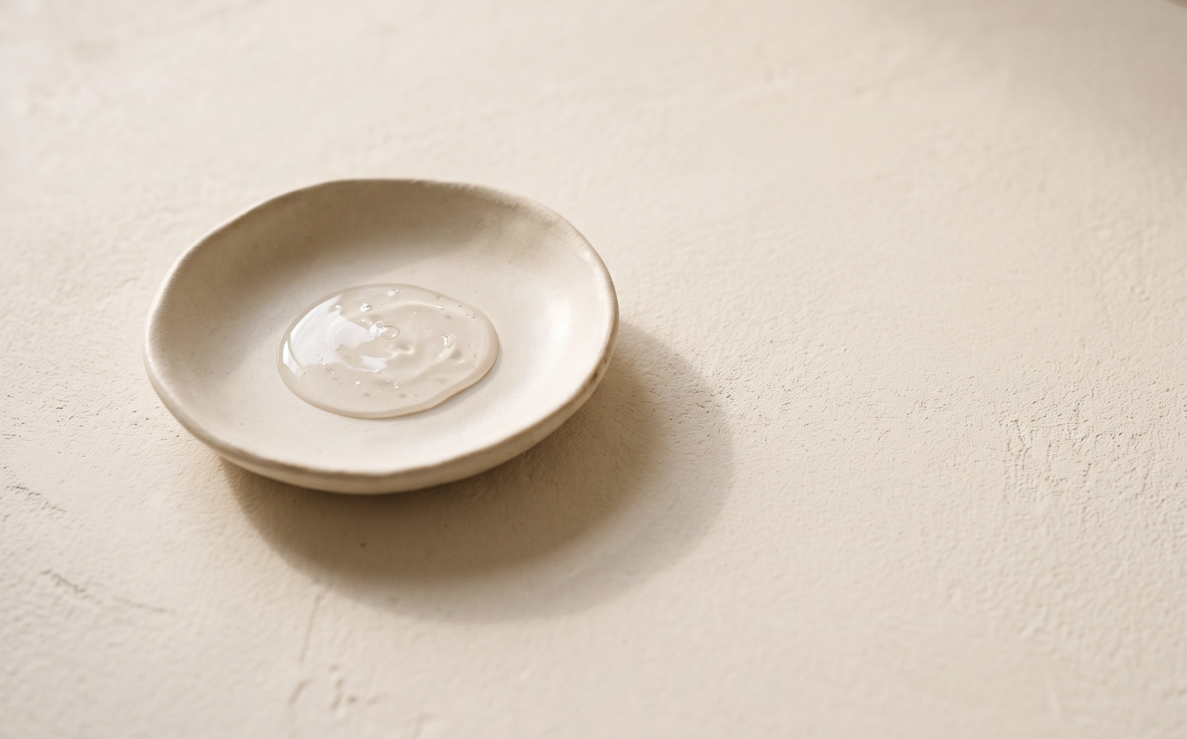 PaxDerm barrier skincare texture in a ceramic dish